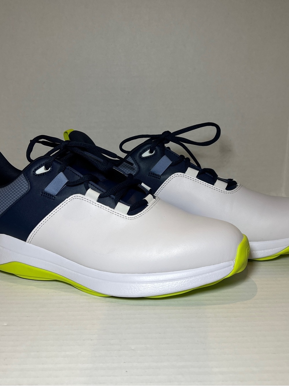 FootJoy Men's ProLite spikeless golf shoes in white, navy, and lime Size 11.5
